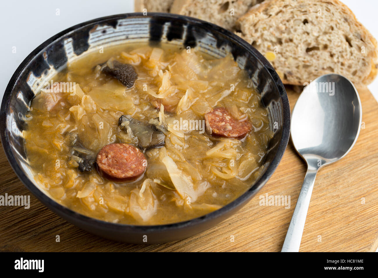 Christmas cabbage soup kapustnica with mushrooms on white background