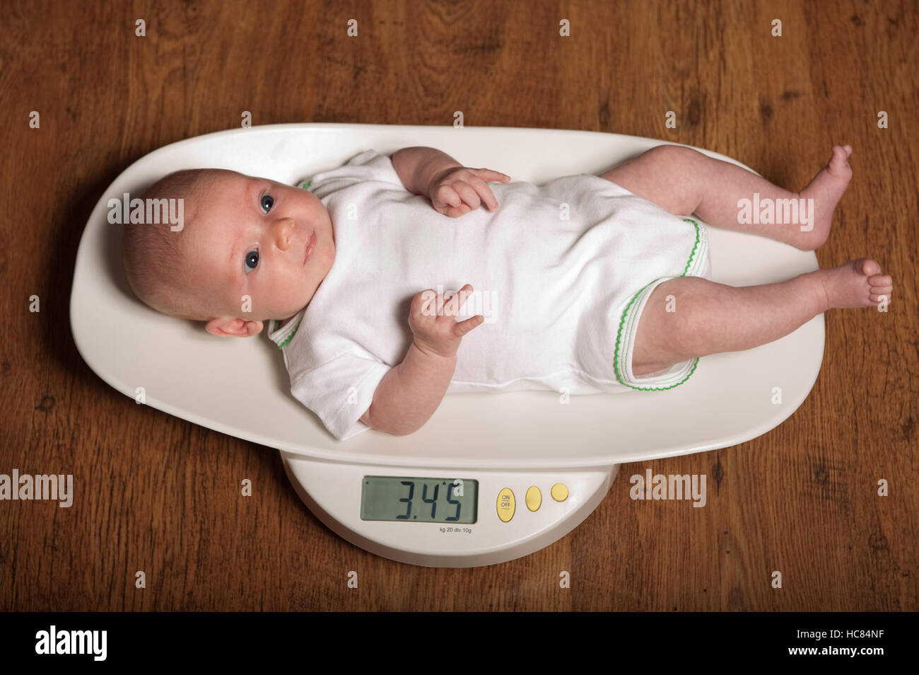 Closeup of 1 Months Old Newborn Baby Boy Lying on Digital Scales or Weighs.  Concept of Babies and Newborn Hygiene and Stock Photo - Image of growth,  girl: 208995290