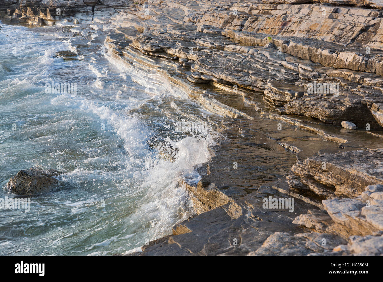 Sunset rocky beach in Istria, Croatia. Solaris summer resort, Adriatic Sea, Lanterna peninsula. HDR Stock Photo