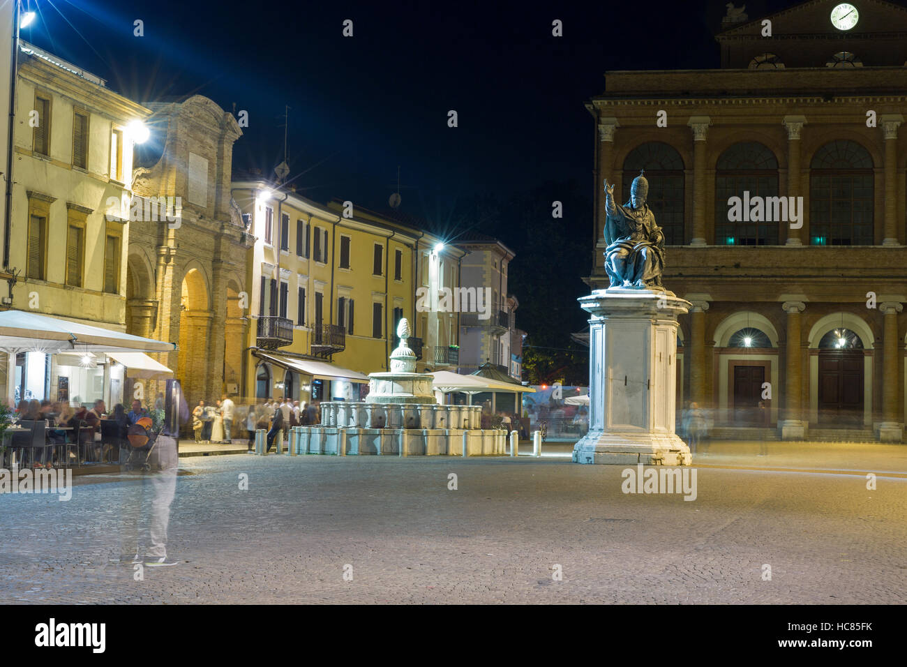 Cavour square with statue of Pope Paul V, Pigna fountain and public theater Amintore Galli at night in Rimini, Italy. Stock Photo