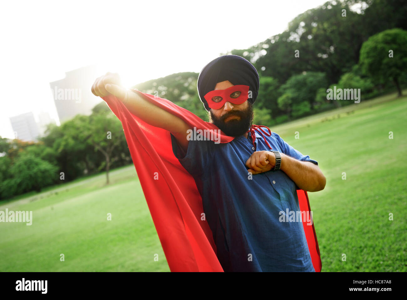 Indian Man Superhero Power Concept Stock Photo
