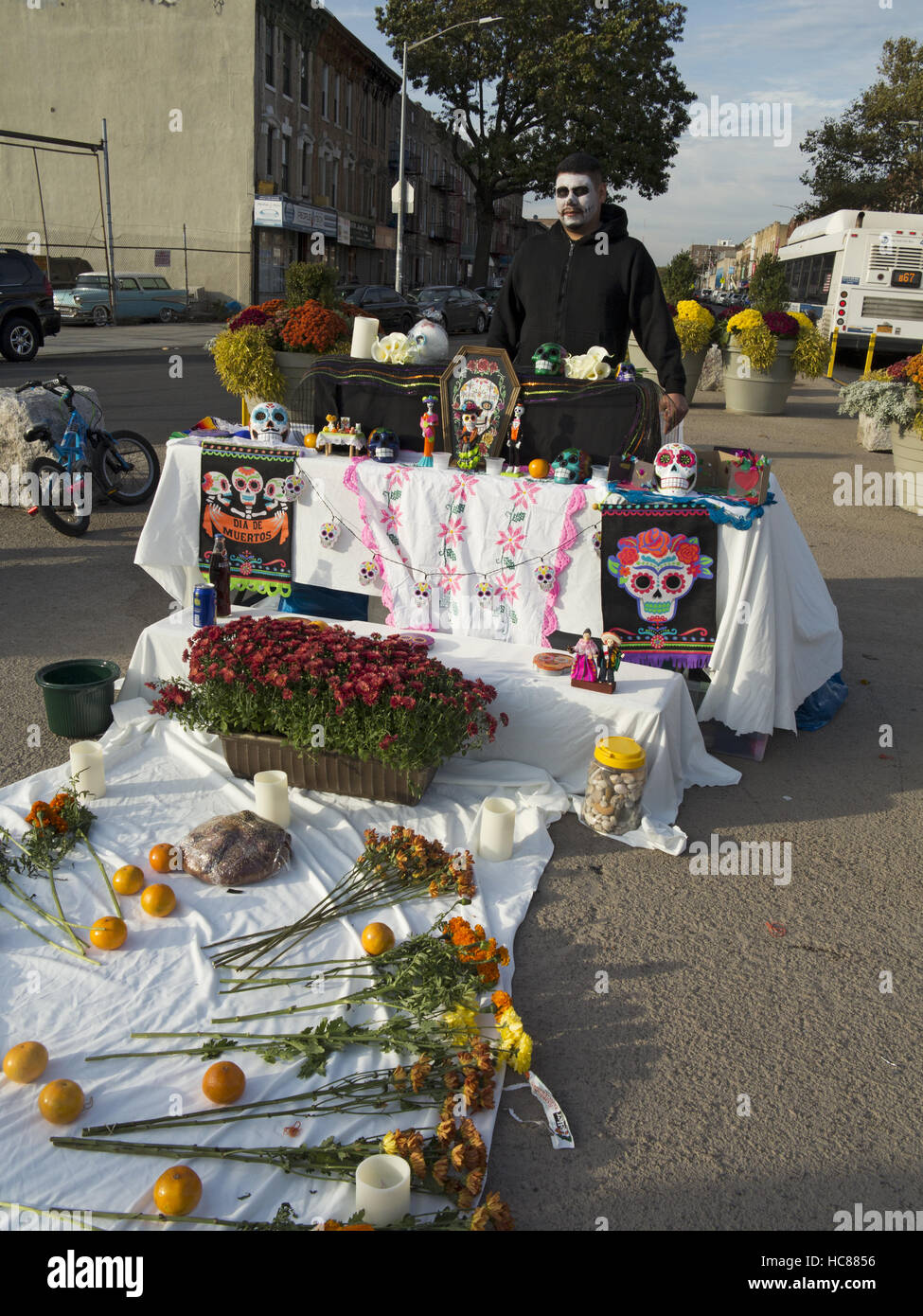 Young, Mexican man in Day of the Dead costume at shrine at First Annual Day of the Dead Celebration in Brooklyn, New York, 2016. Stock Photo