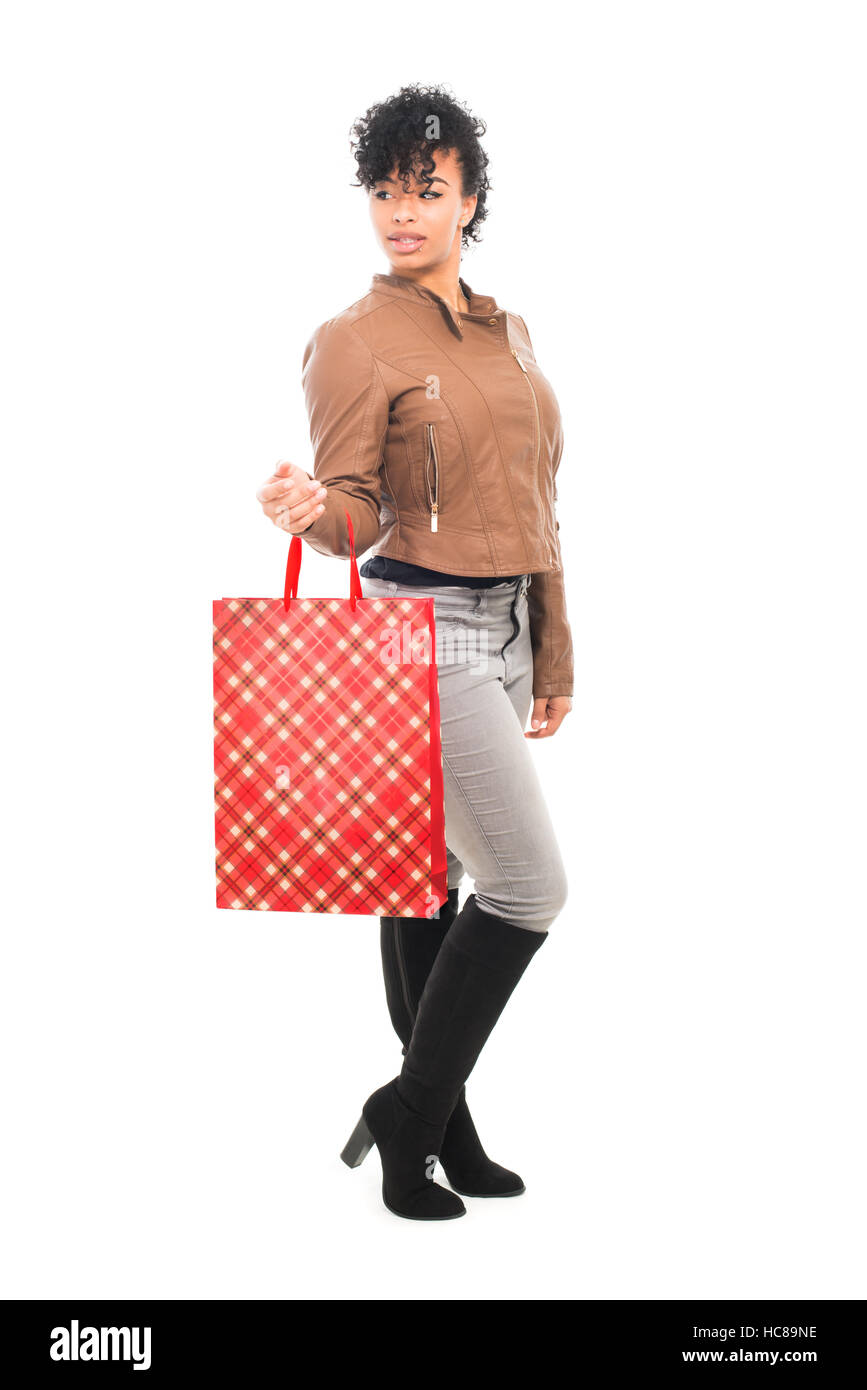 cute teenage girl in jeans clothes with shopping bags isolated on white  background Stock Photo - Alamy