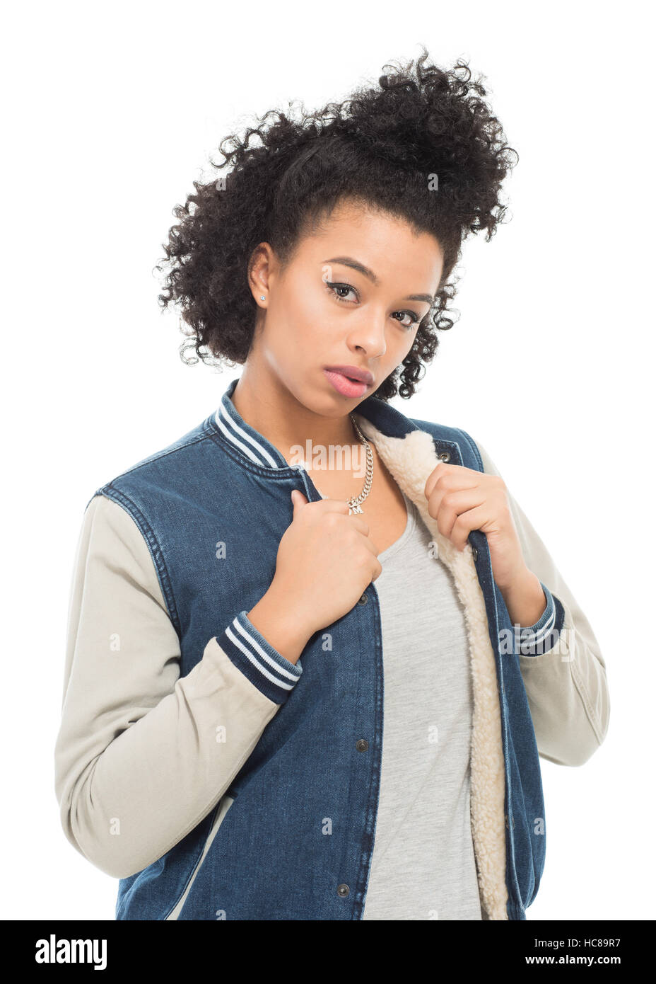 Teenage model with urban fashion clothes isolated on a white background