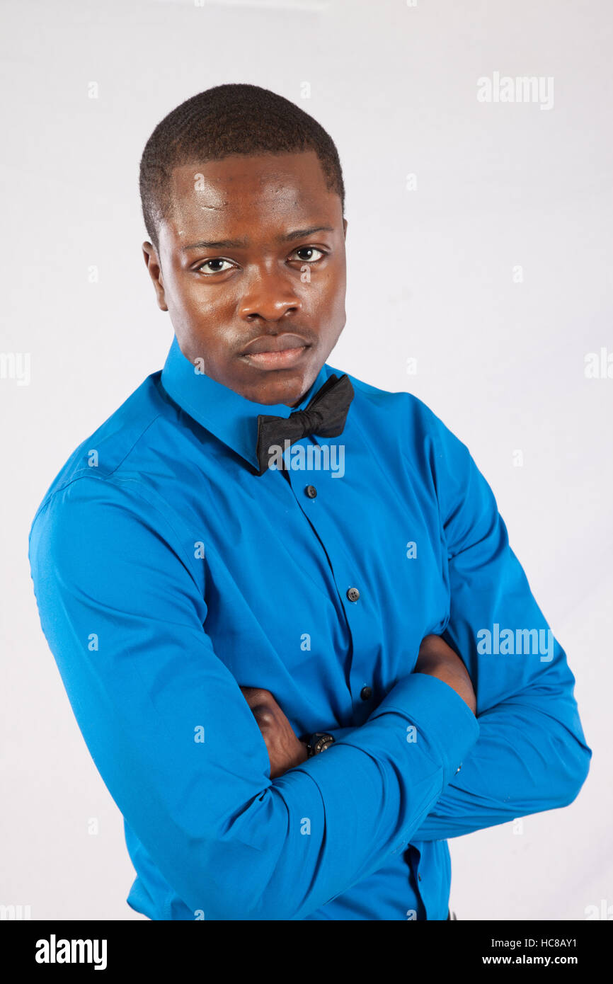 Handsome Black man looking serious with his arms crossed Stock Photo