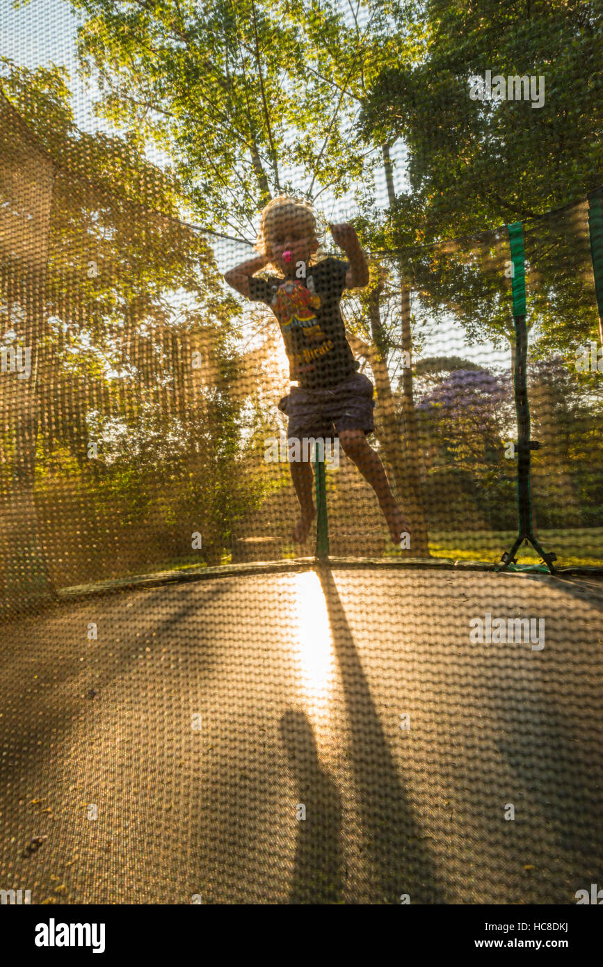 Small children jump on a trampoline Stock Photo Alamy