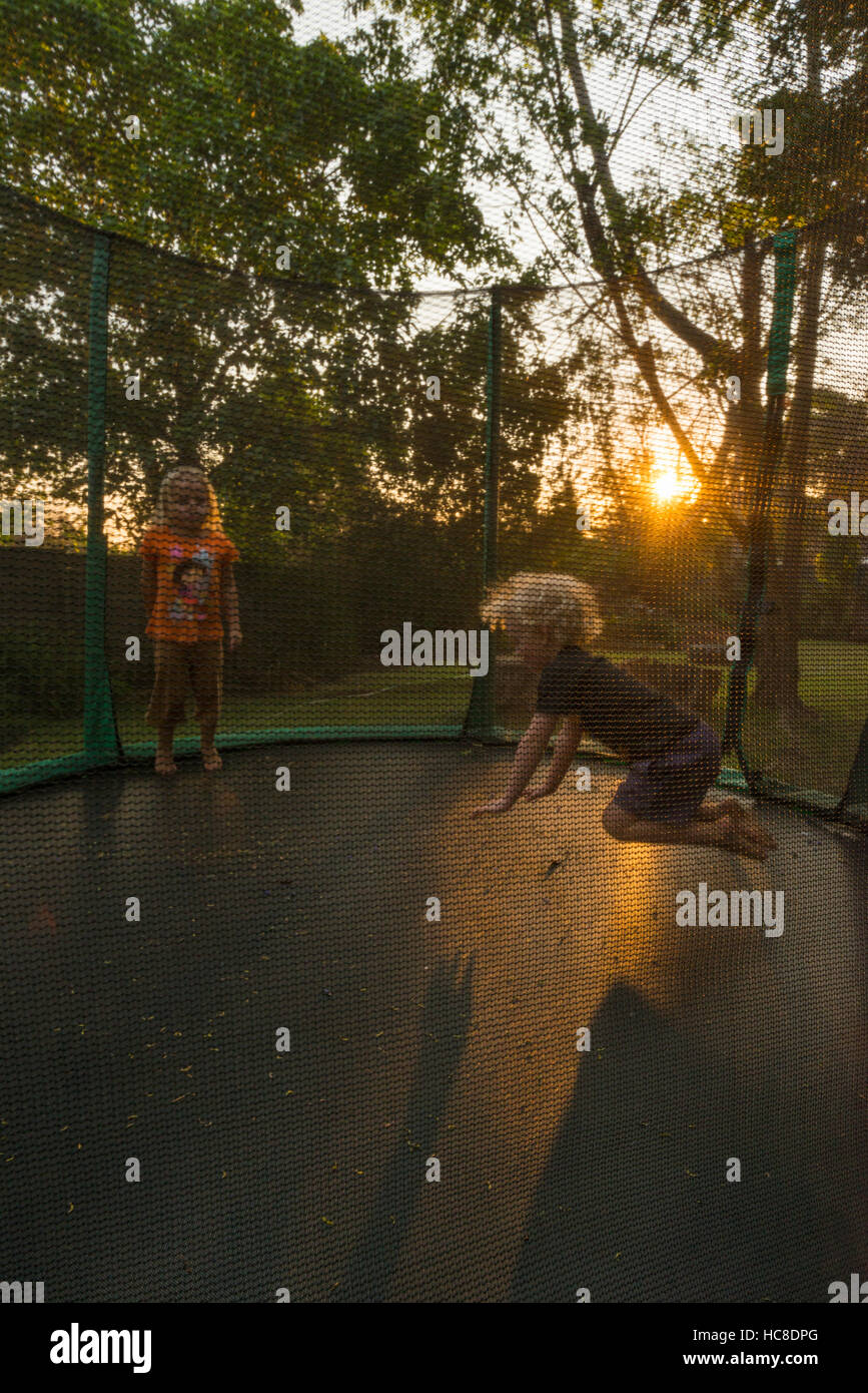 Small children jump on a trampoline Stock Photo Alamy