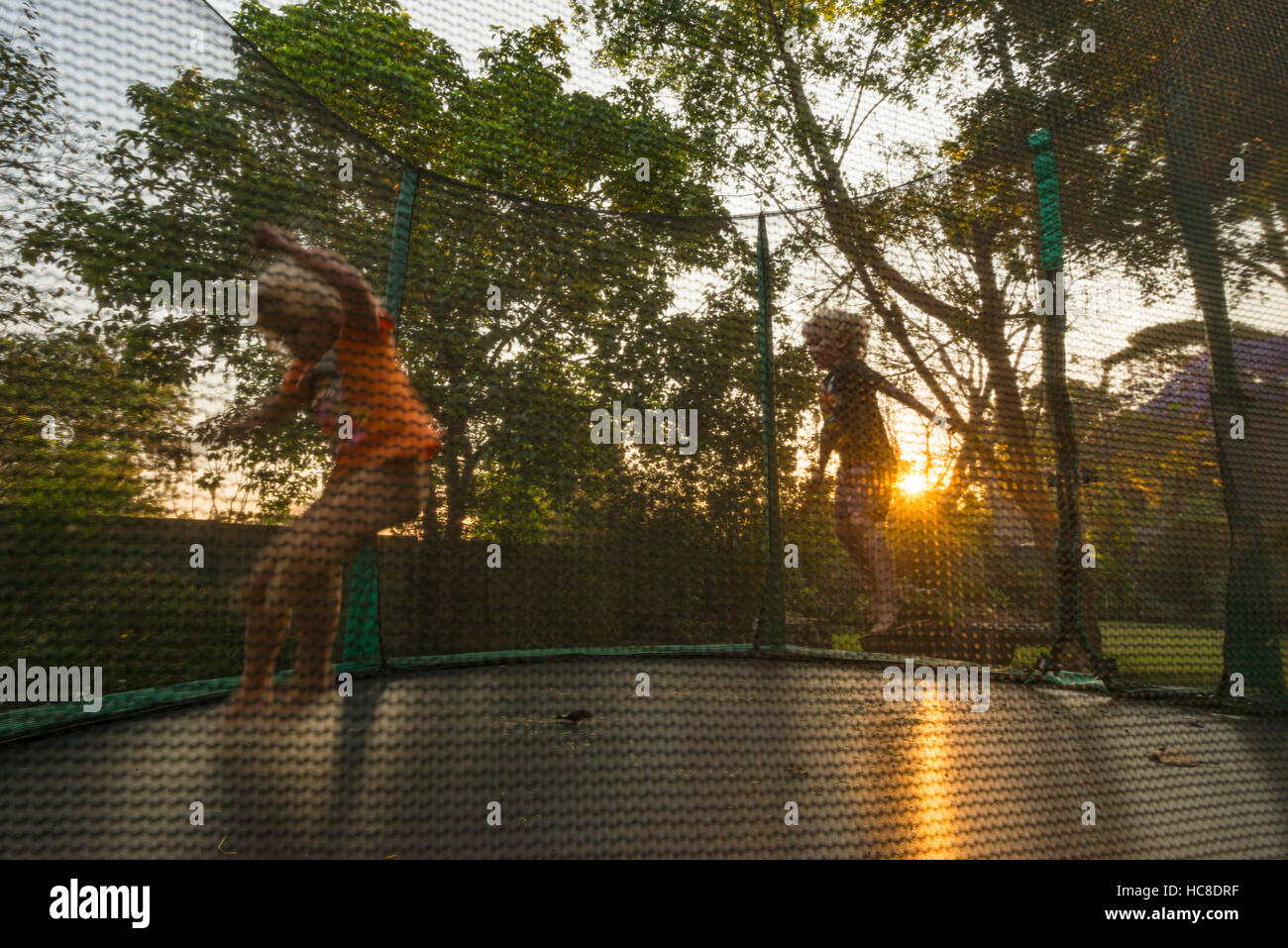 Small children jump on a trampoline Stock Photo Alamy