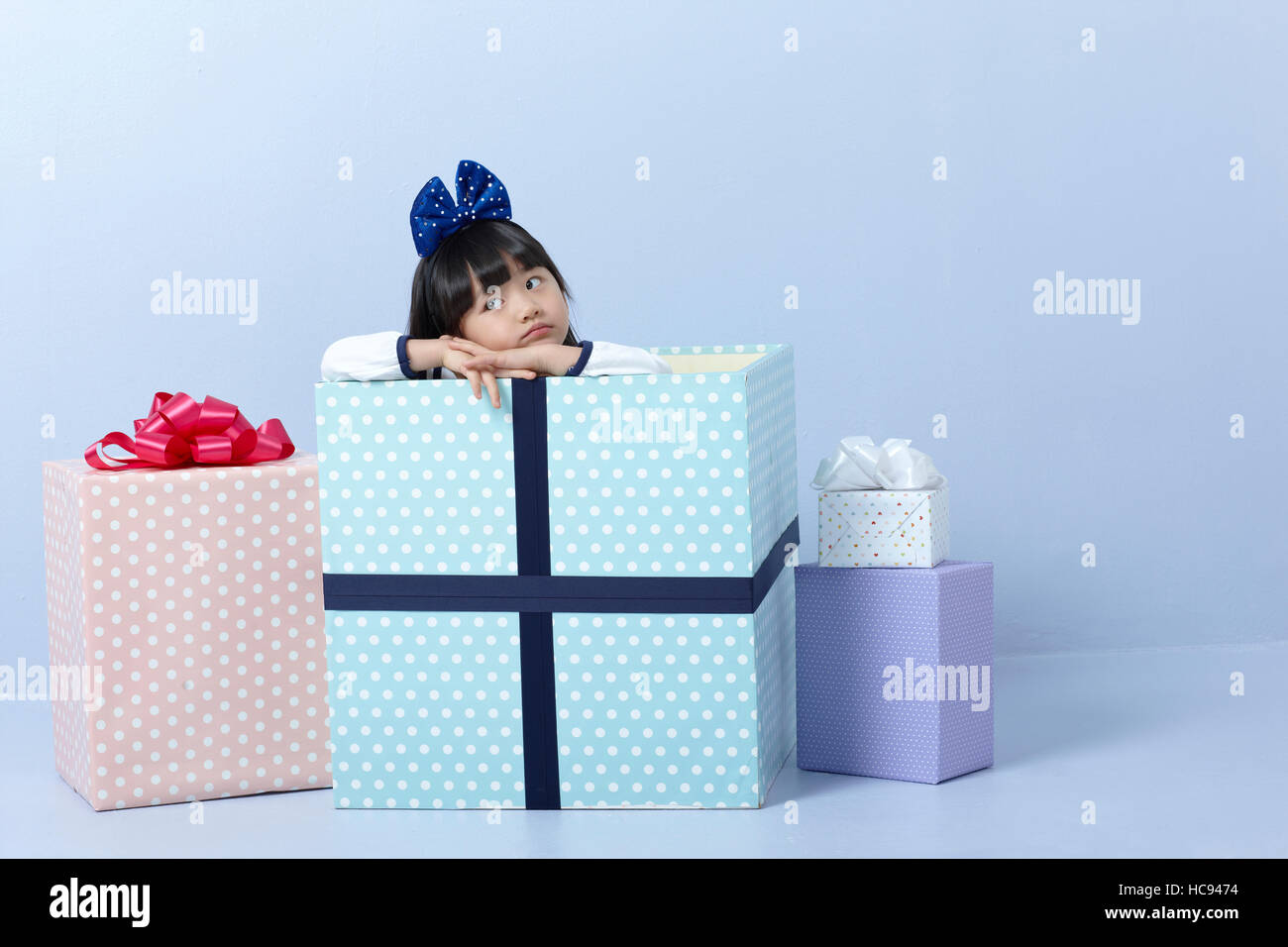 Portrait of girl with present boxes Stock Photo - Alamy