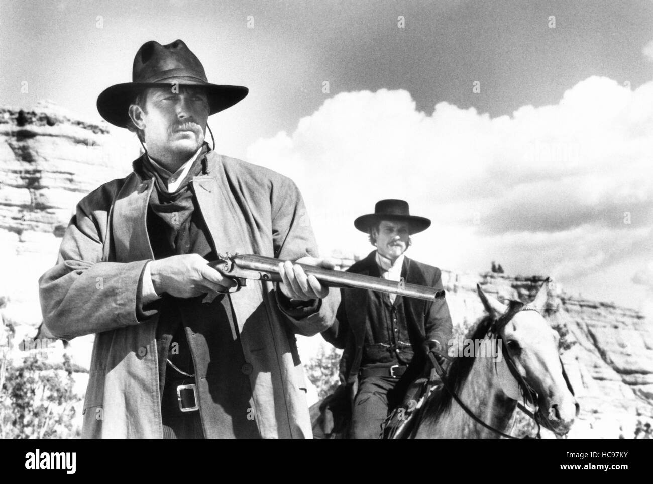 WYATT EARP, from left: Kevin Costner as Wyatt Earp, Dennis Quaid as Doc ...