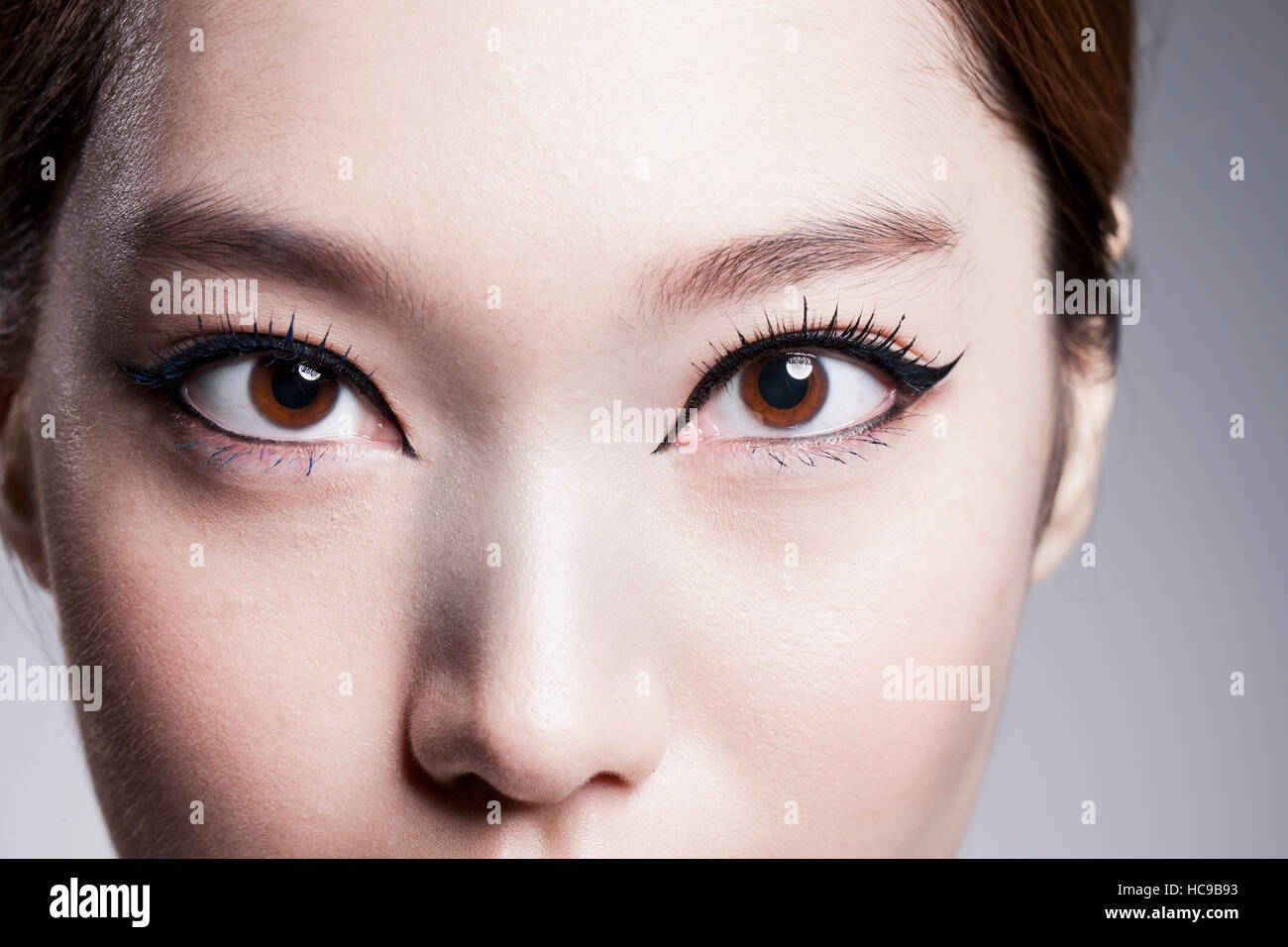 Face of young Korean woman with black eyeliner Stock Photo