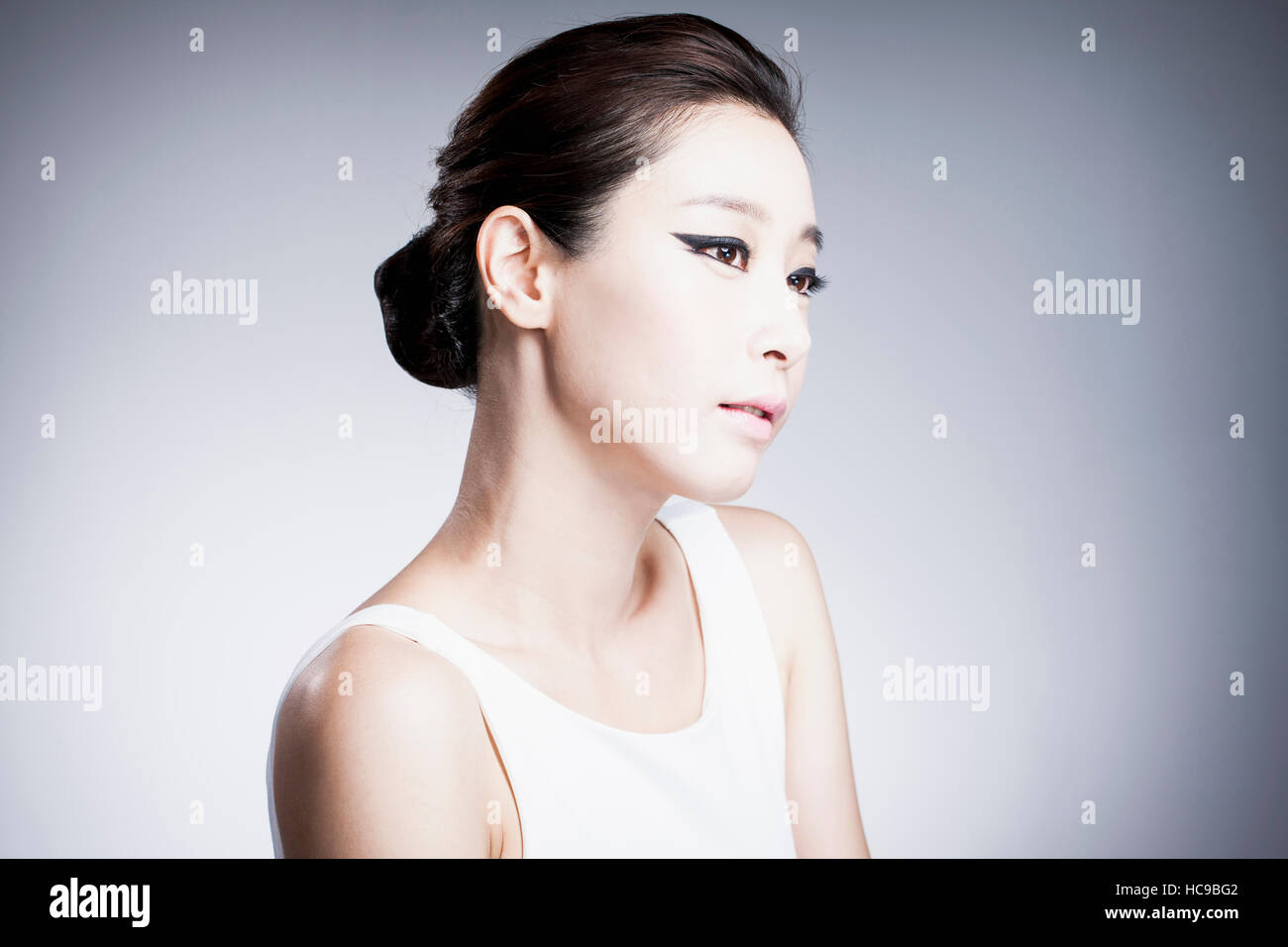 Side view of young Korean woman in black eyeliner Stock Photo