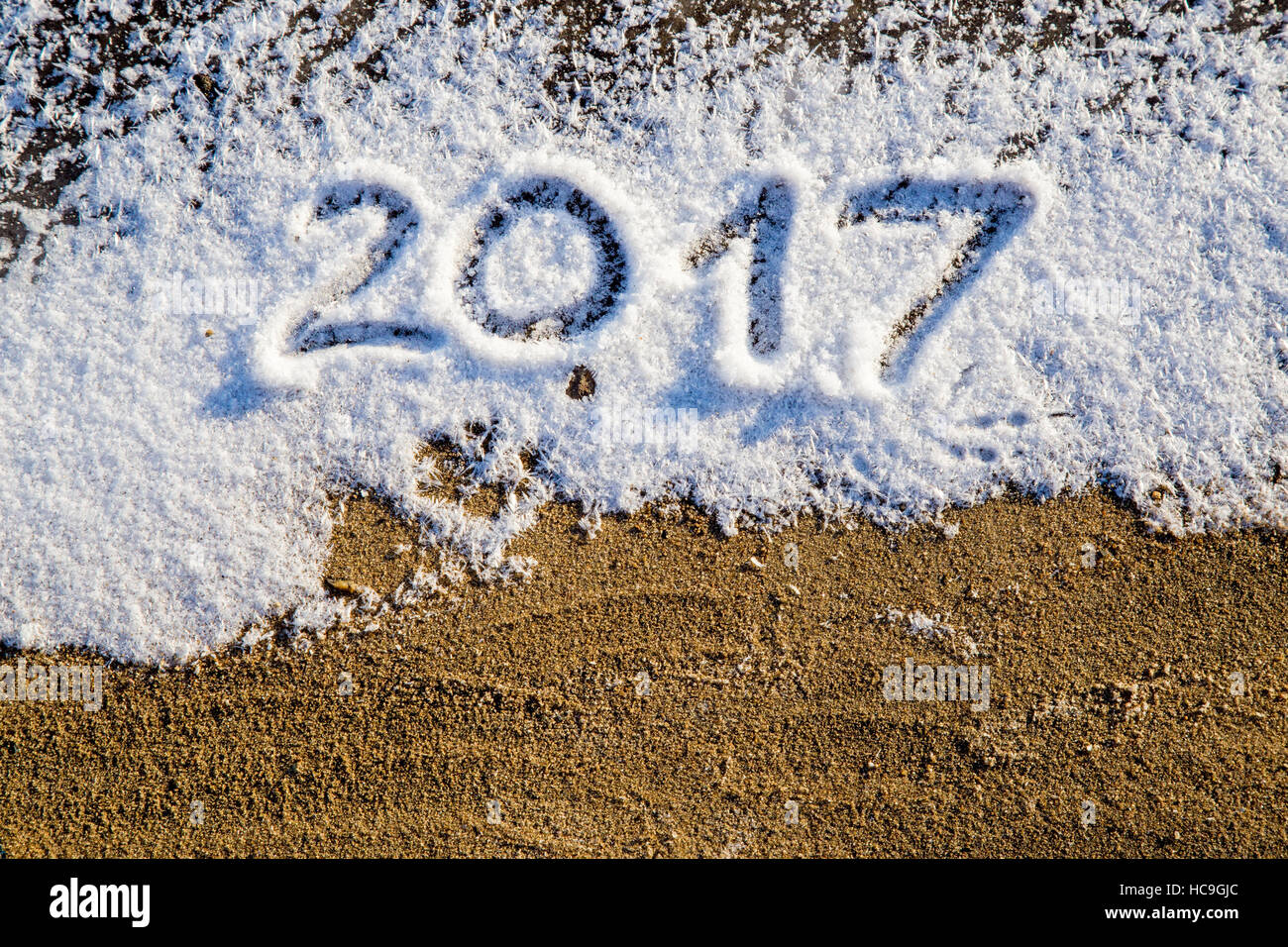 New Year 2017 greeting,  numbers written on snow field, Stock Photo