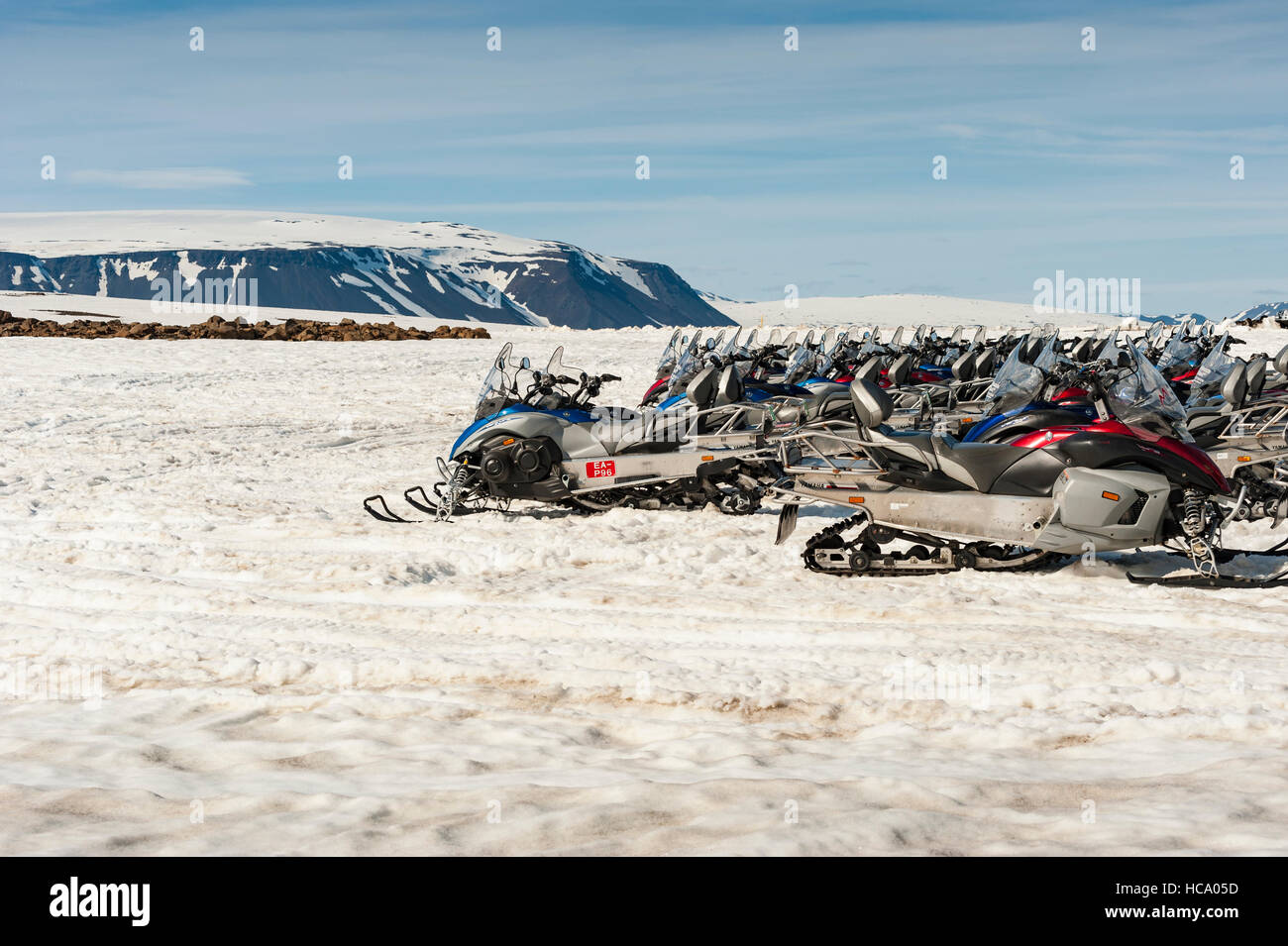 Several snowmobiles parked in a snow-capped plateau off road F336 in Iceland. Stock Photo