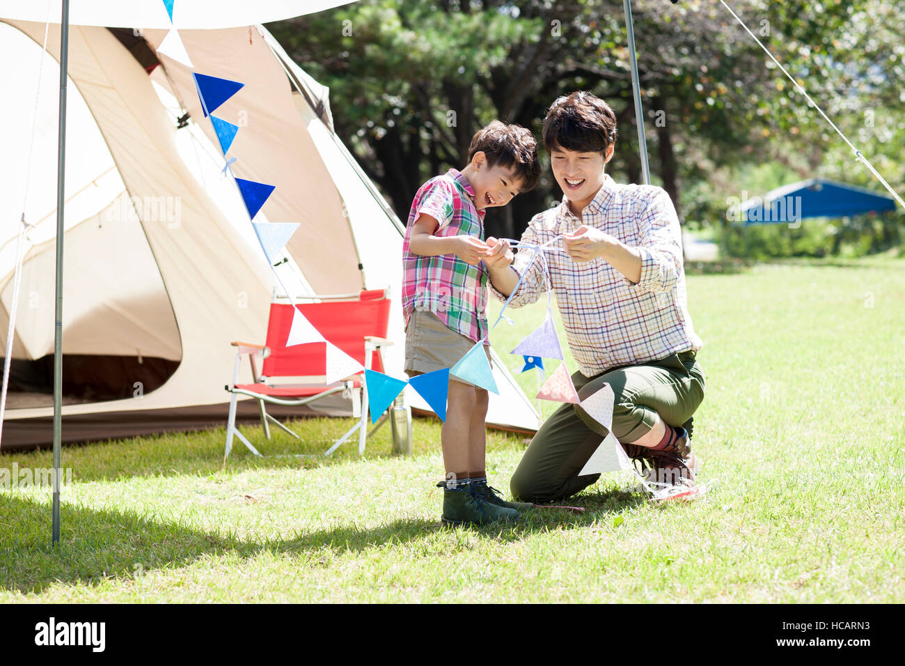 Loving father and son at camping ground Stock Photo - Alamy