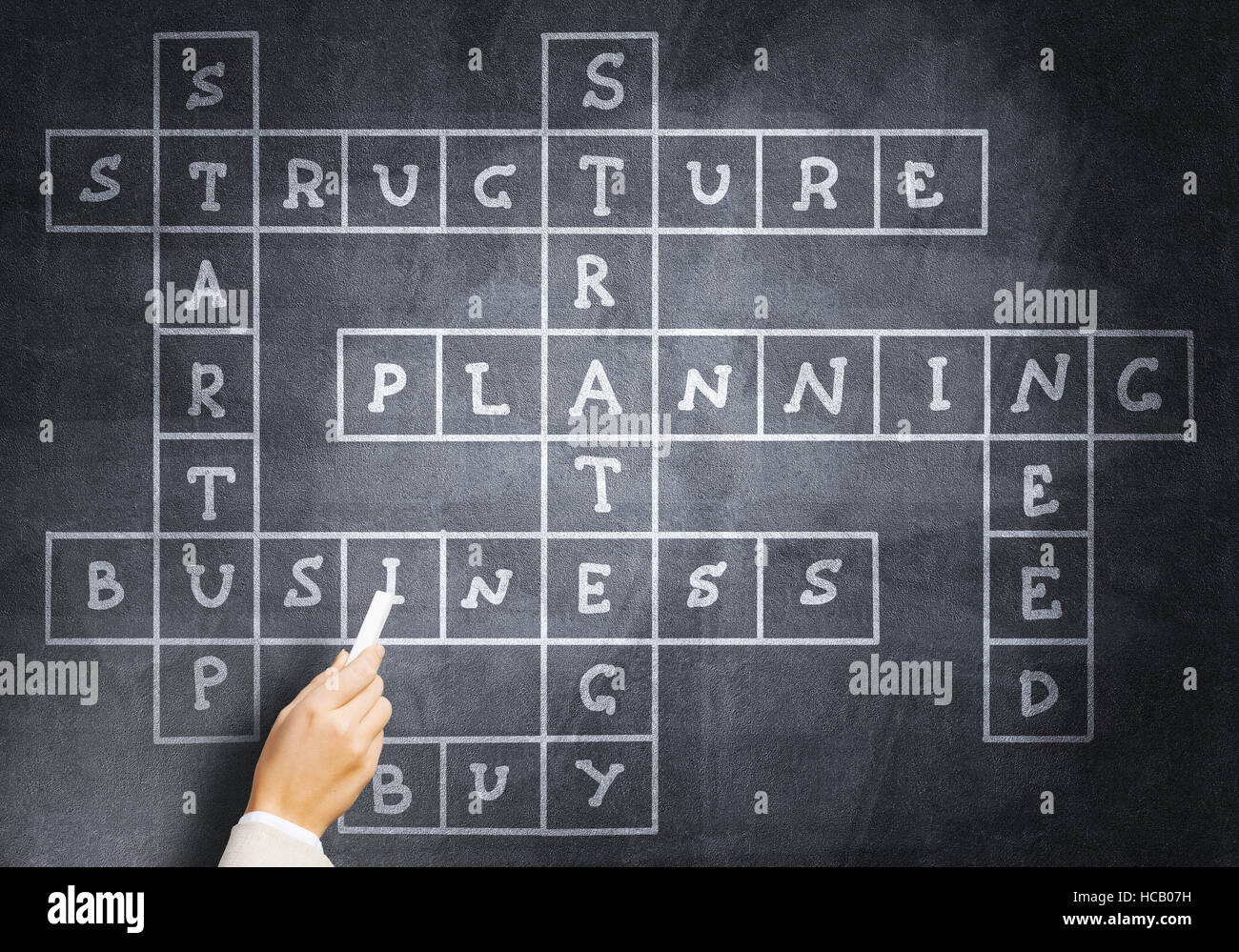 Woman draw crossword Stock Photo Alamy