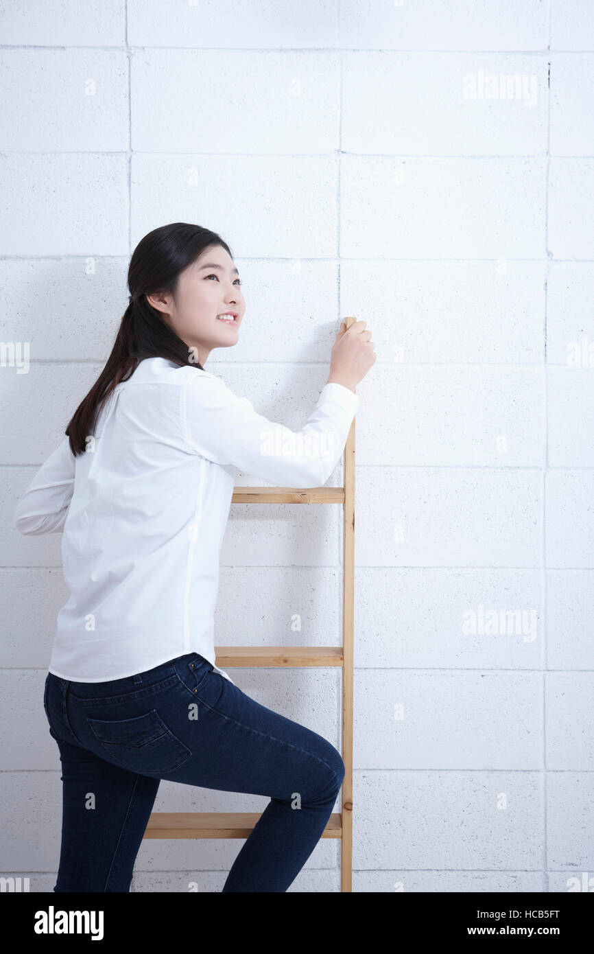 Student climbing ladder hi-res stock photography and images - Alamy