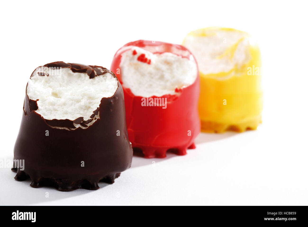 Bitten into chocolate marshmallows in German colours Stock Photo Alamy
