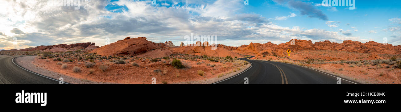 Road between red sandstone formations, Valley of Fire, Mojave Desert, Nevada, USA Stock Photo