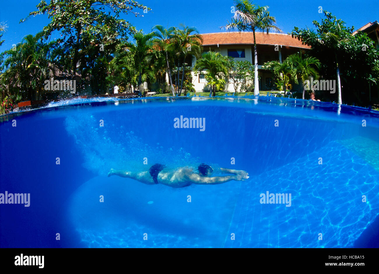 Man in a swimming pool, Tulamben, Bali, Indonesia, South East Asia Stock Photo