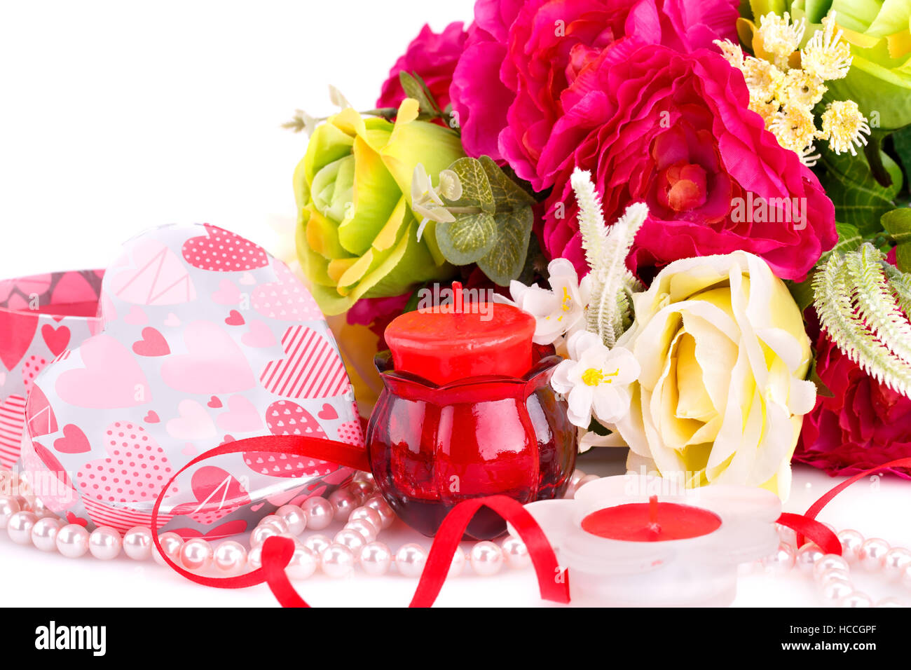 Colorful flowers, candles and gift box close up picture. Stock Photo