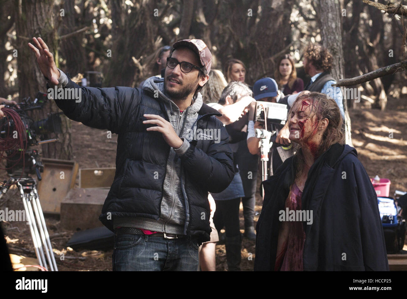EVIL DEAD, left: Director Fede Alvarez, Jane Levy, on set, 2013, ph: Kirsty Griffin/©TriStar Pictures/courtesy Everett Stock Photo