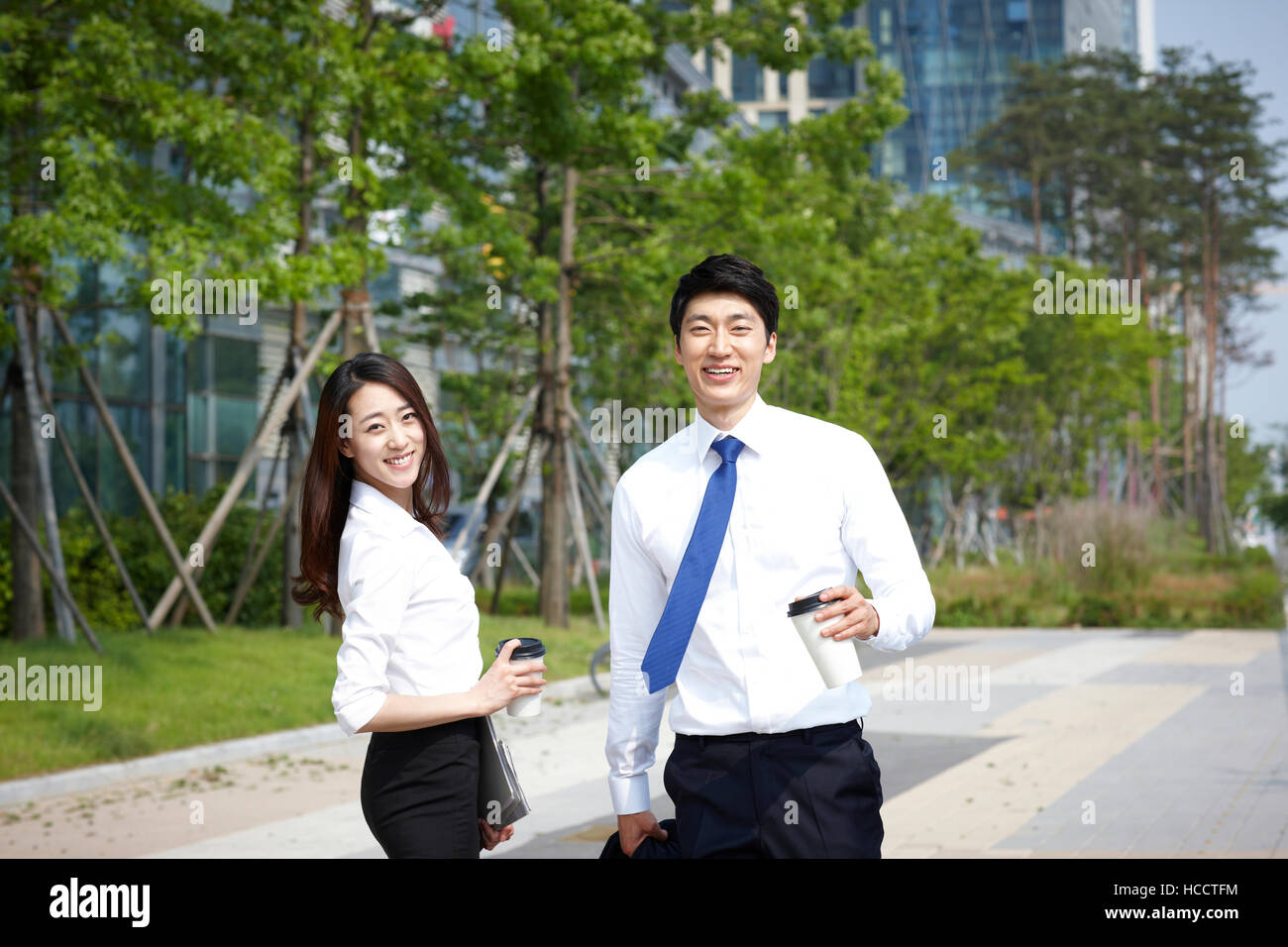 Young smiling business people Stock Photo - Alamy