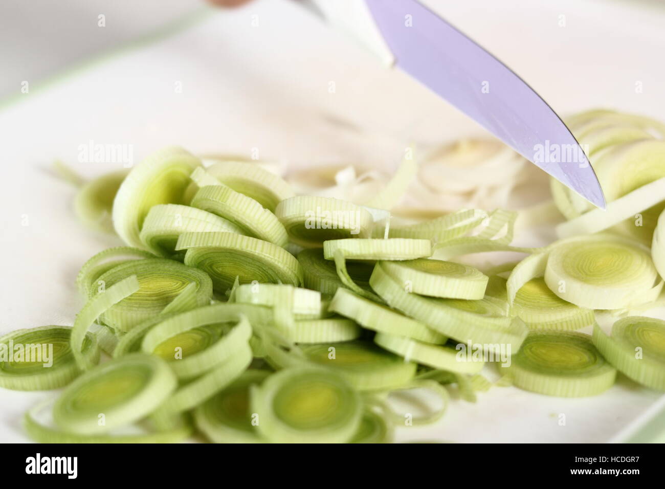 Sliced Leek on cutting board. Making Chicken, Cheese and Leek Parcel ...