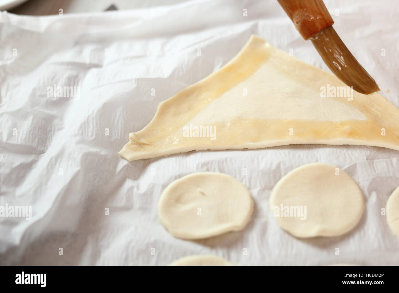 Brush with Egg Glaze Tail Shape Puff Pastry Pieces. Making Salmon in