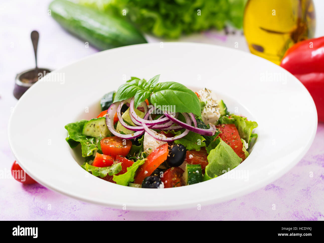 Greek salad with fresh tomato, cucumber, red onion, basil, lettuce