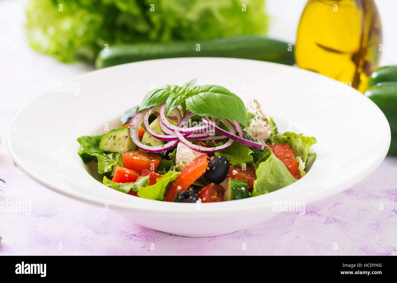 Greek salad with fresh tomato, cucumber, red onion, basil, lettuce