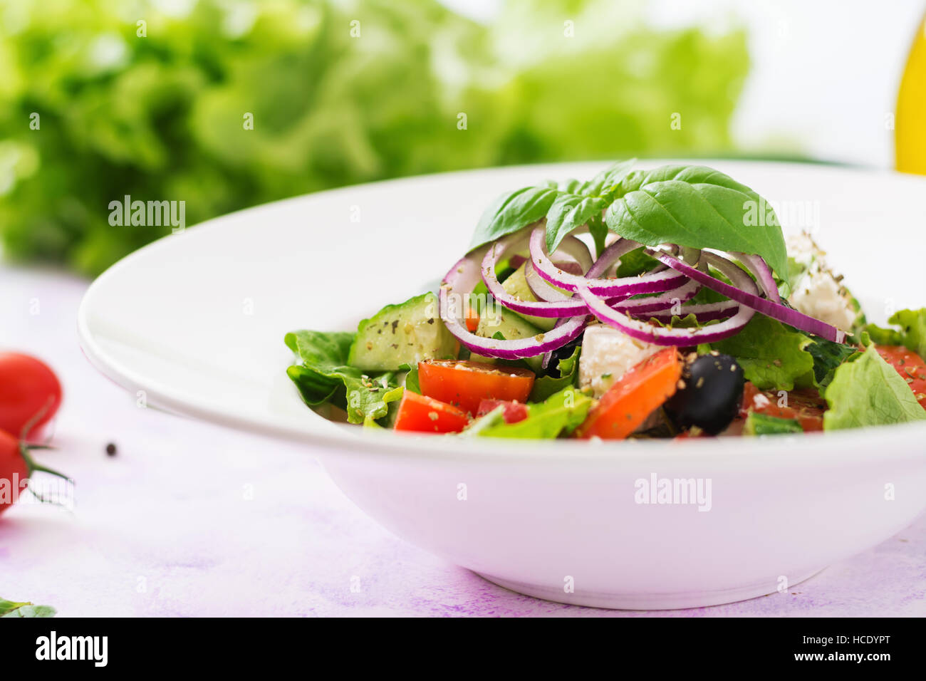 Greek salad with fresh tomato, cucumber, red onion, basil, lettuce