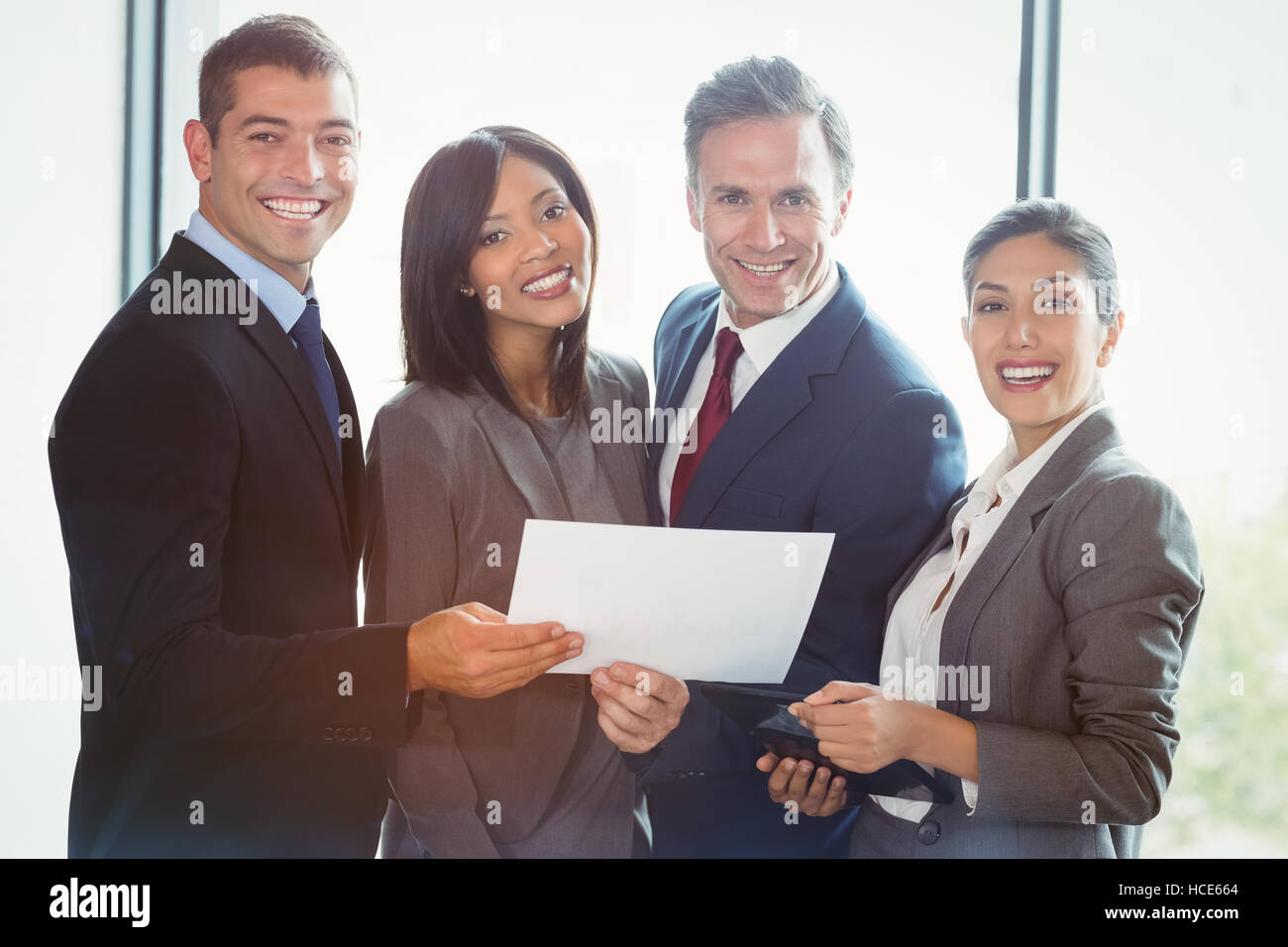 Portrait of business people standing together Stock Photo - Alamy