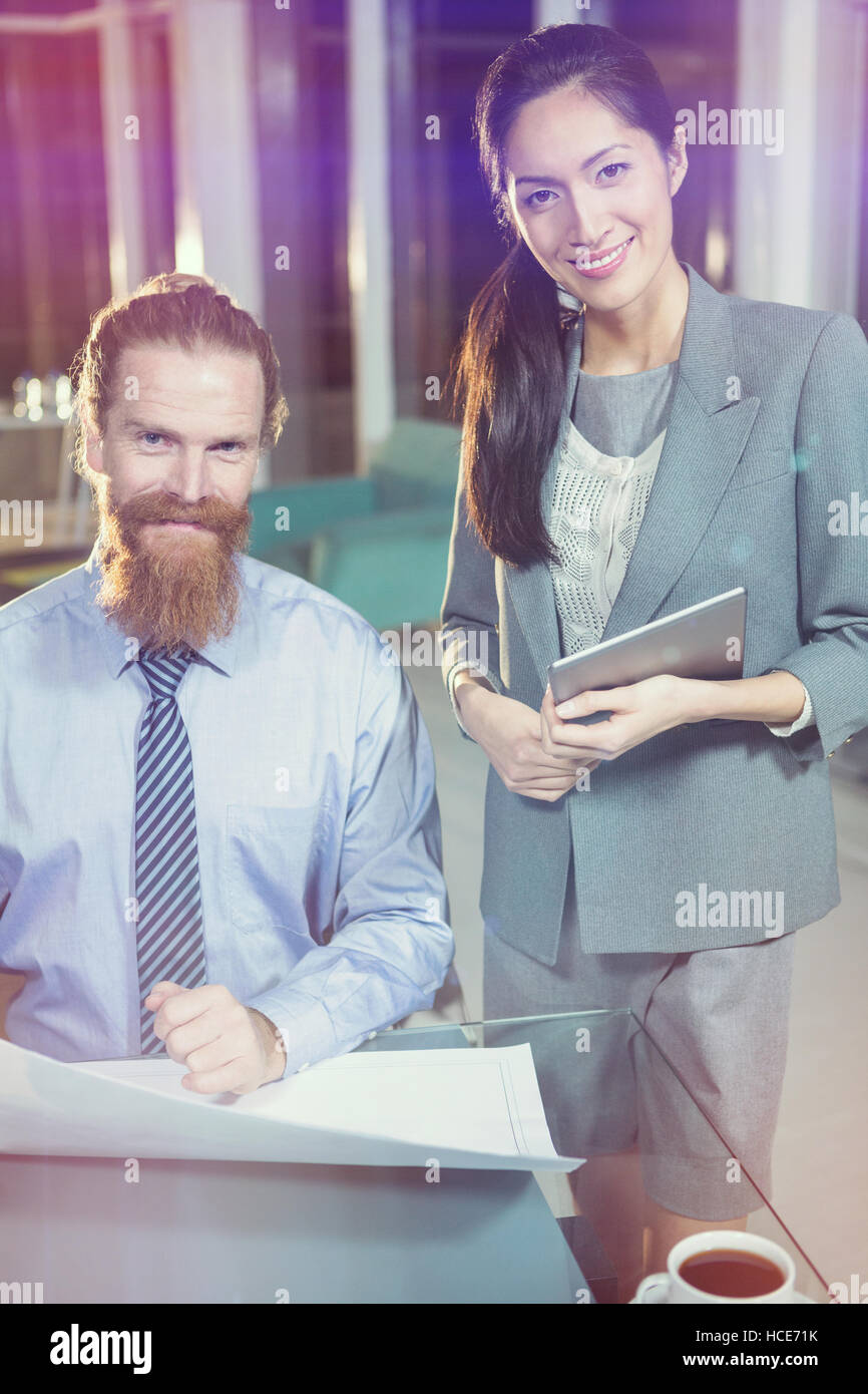 Colleague holding blueprint tablet hi-res stock photography and images ...