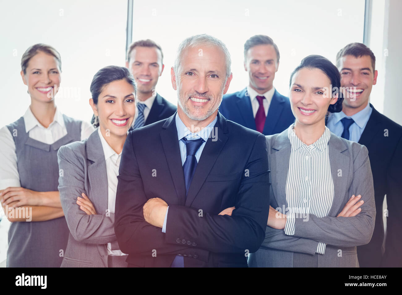 Team of businesspeople posing together Stock Photo - Alamy