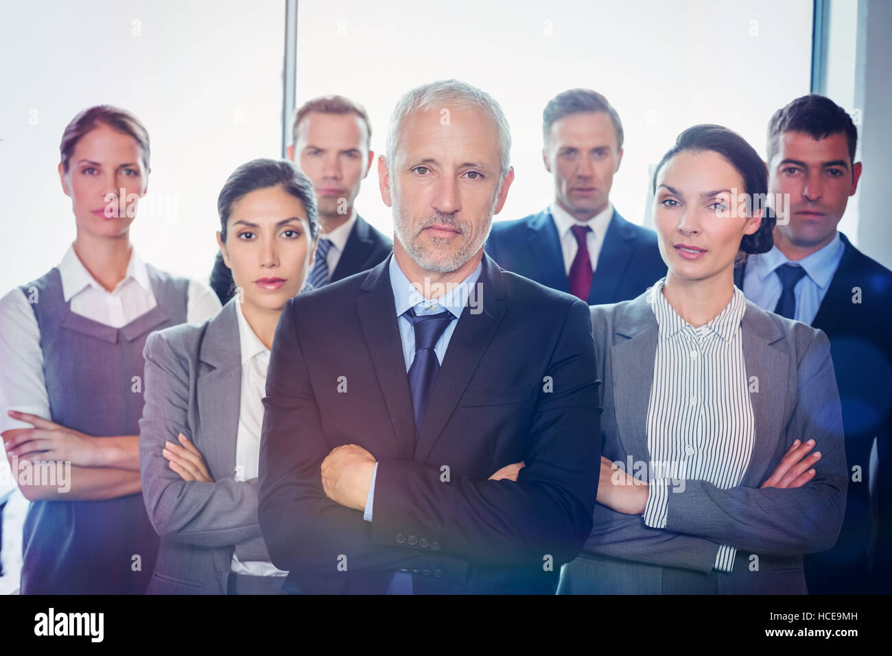 Team of businesspeople posing together Stock Photo - Alamy