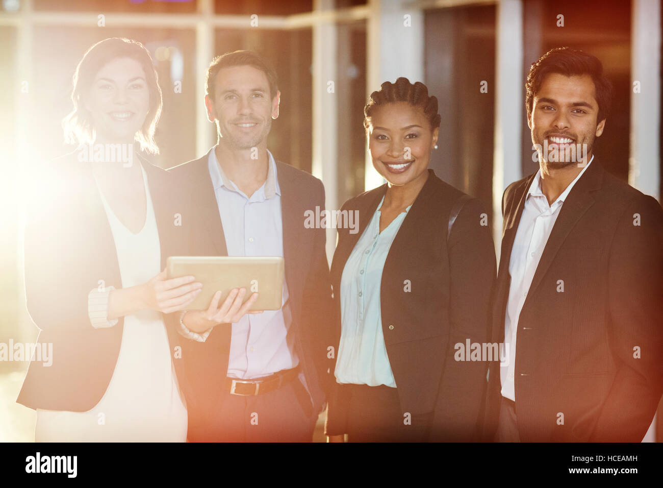 Portrait of businesspeople standing Stock Photo - Alamy