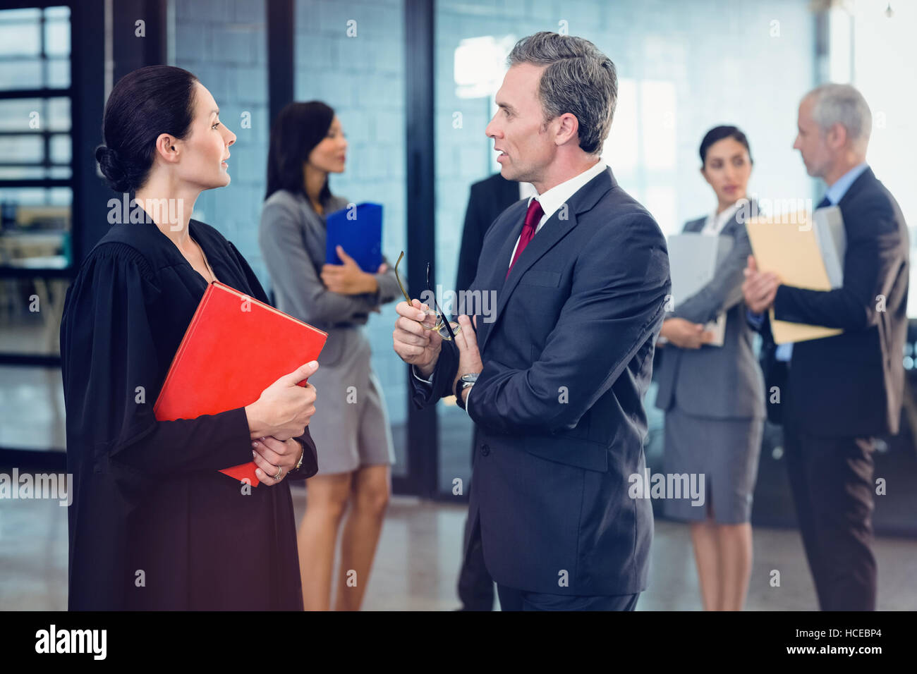 Side view of lawyer interacting with businessman Stock Photo