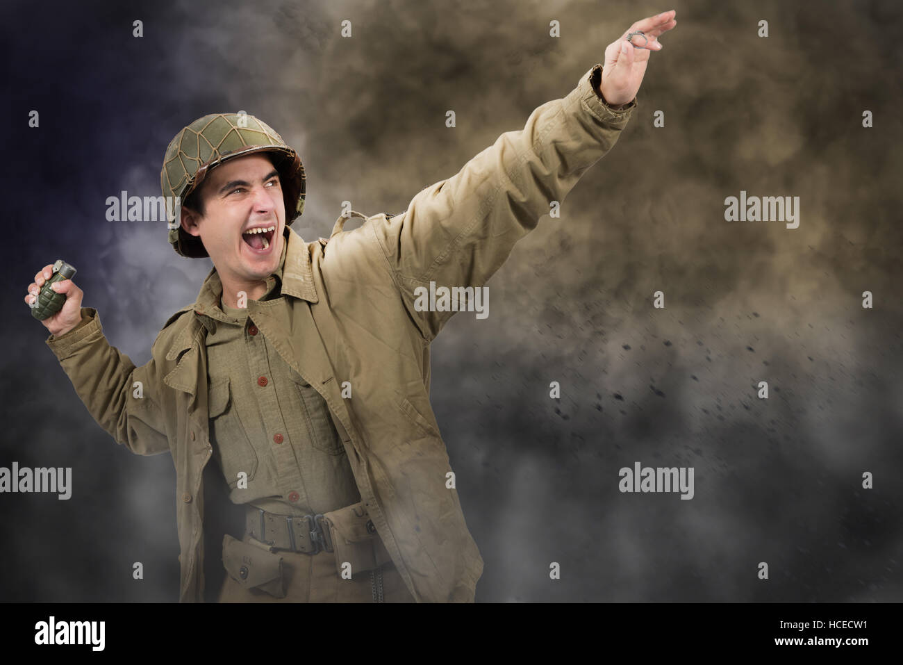young American soldier ww2 throwing a grenade Stock Photo