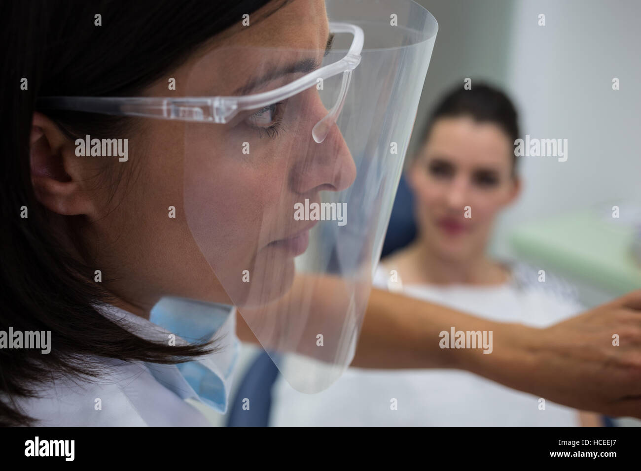 Dentist wearing protective face mask Stock Photo Alamy