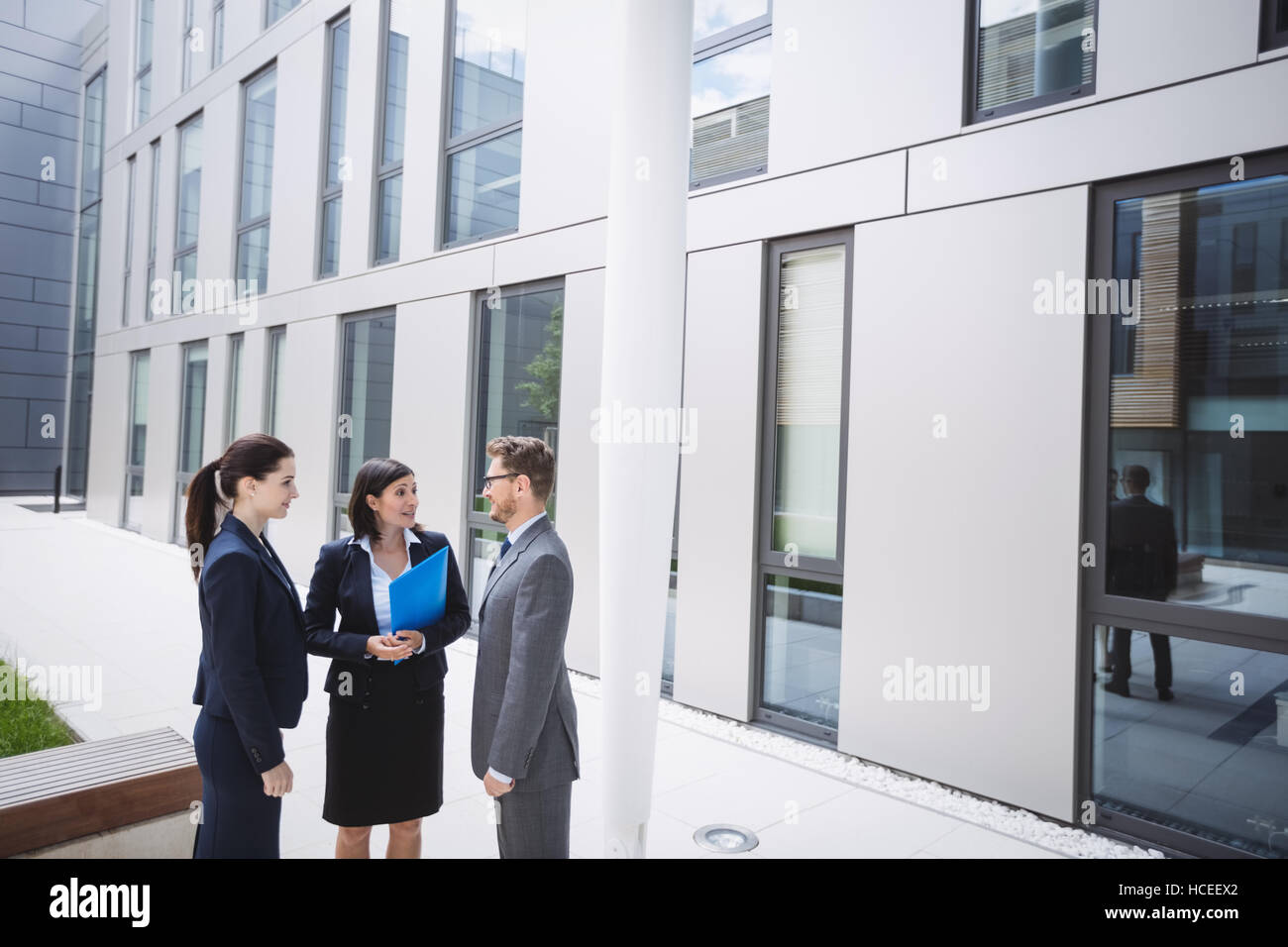 Businessman talking with colleagues Stock Photo