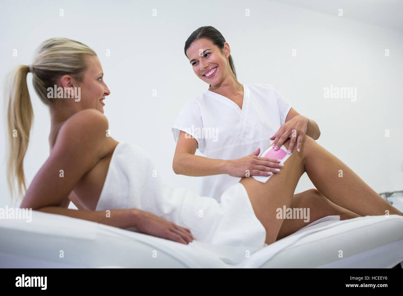 Woman getting her leg hair removed Stock Photo