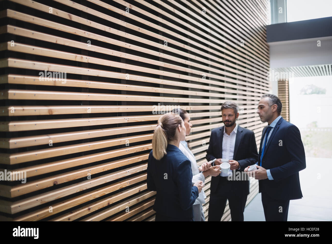 Businesspeople having a discussion during breaktime Stock Photo