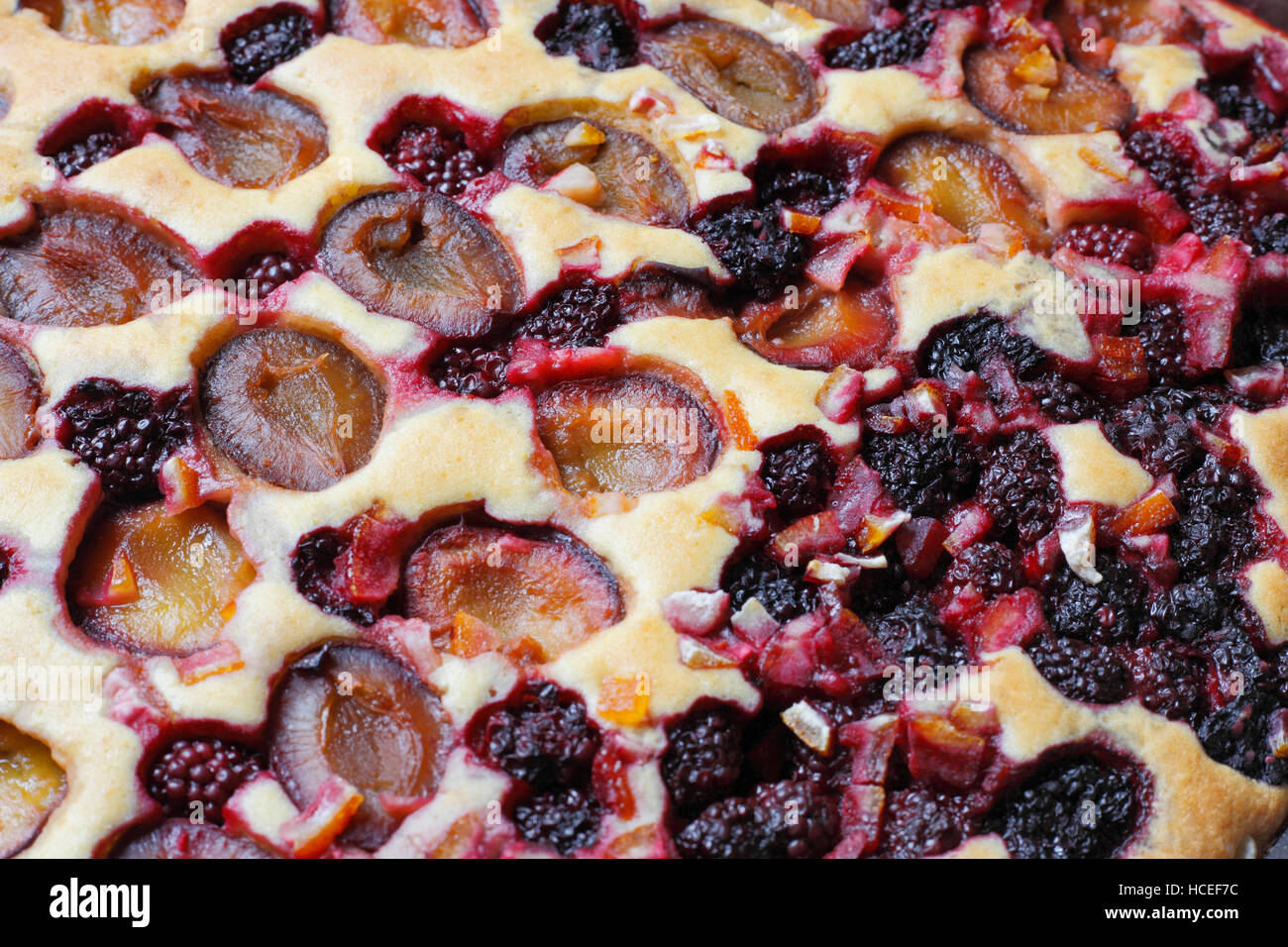 Fruit cake with plums and blackberries Stock Photo