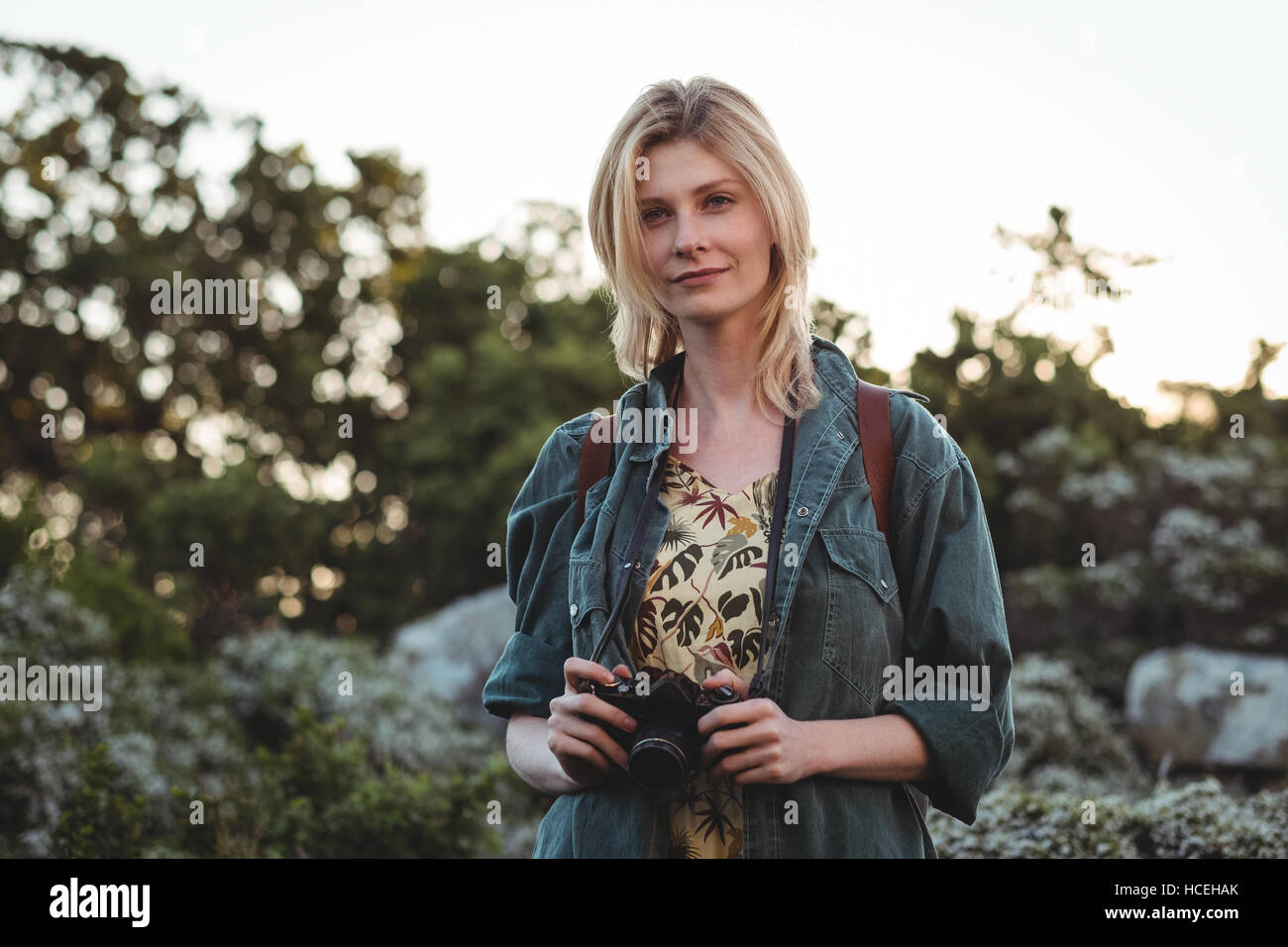 Woman holding digital camera Stock Photo