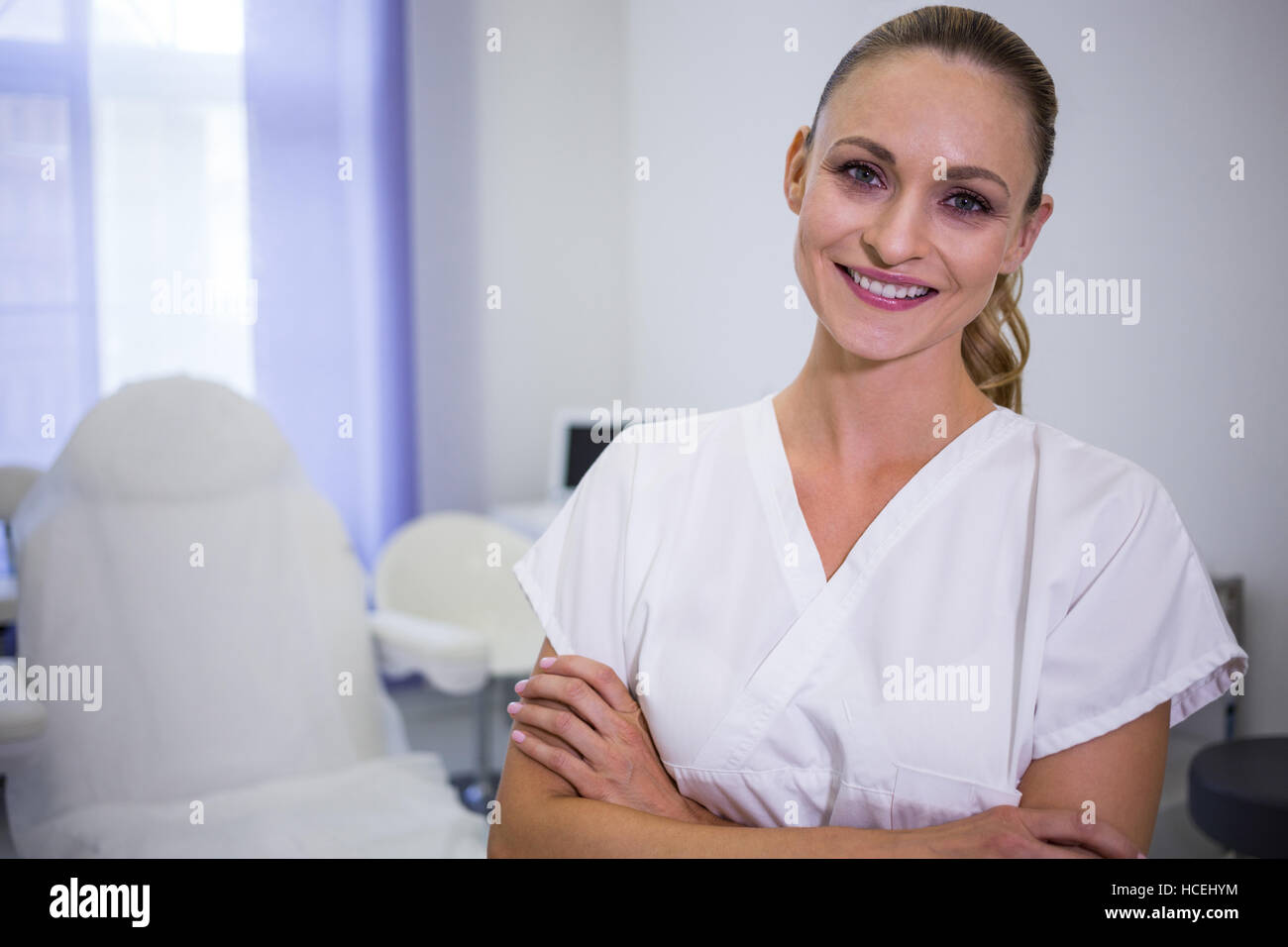 Portrait of dentist standing with arms crossed Stock Photo