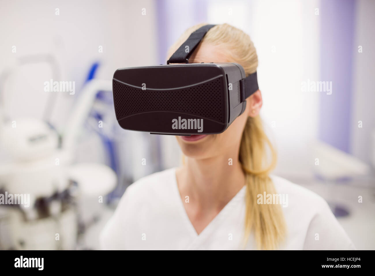 Female doctor wearing virtual reality headset Stock Photo