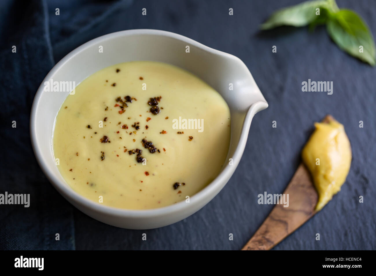 Homemade Creamy Honey Mustard dressing in a bowl Stock Photo