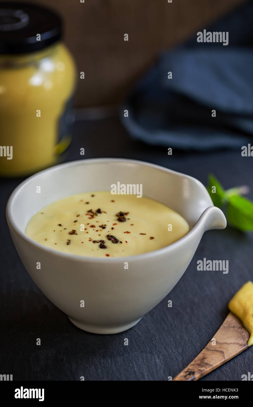 Homemade Creamy Honey Mustard dressing in a bowl Stock Photo