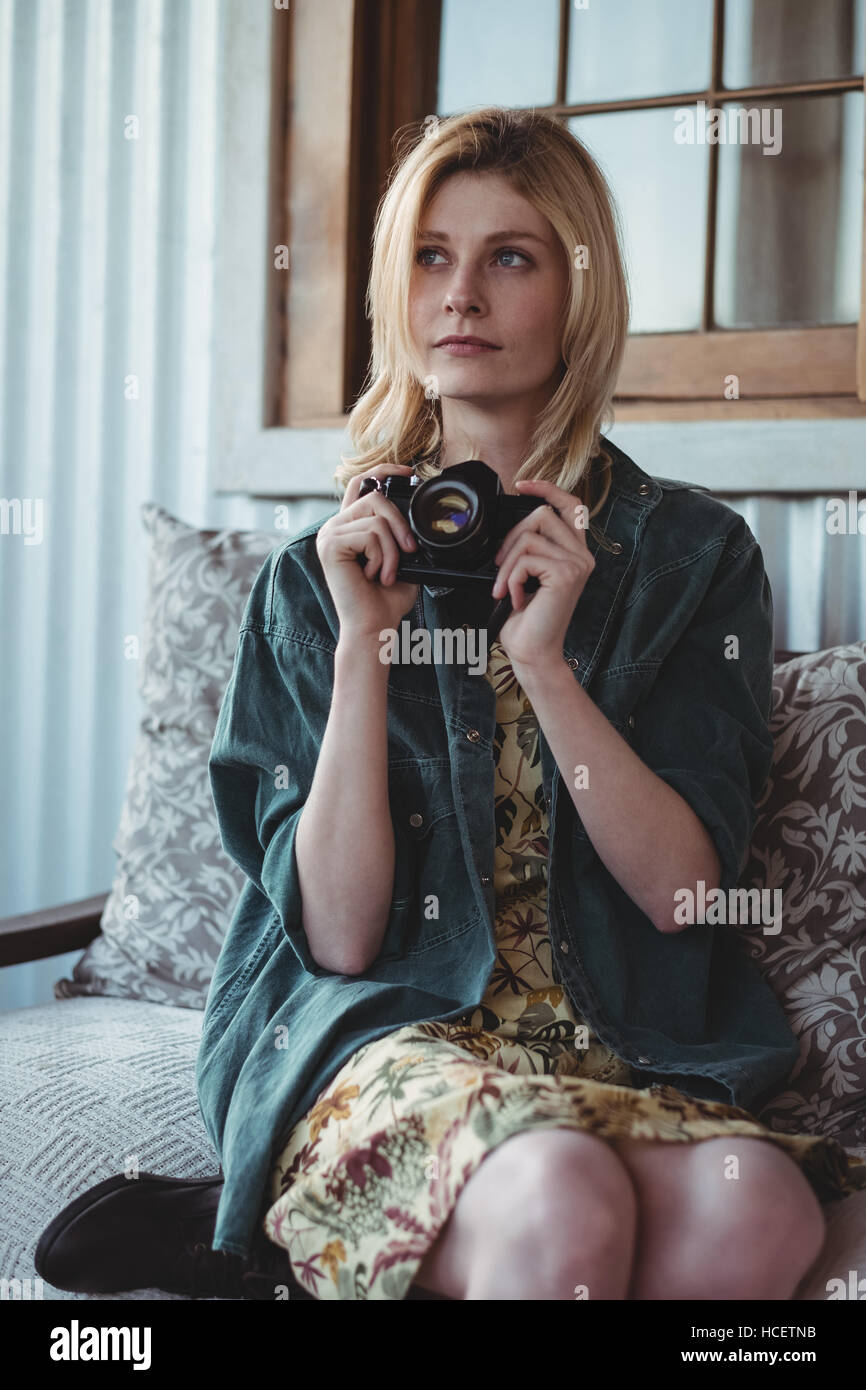 Woman holding digital camera Stock Photo